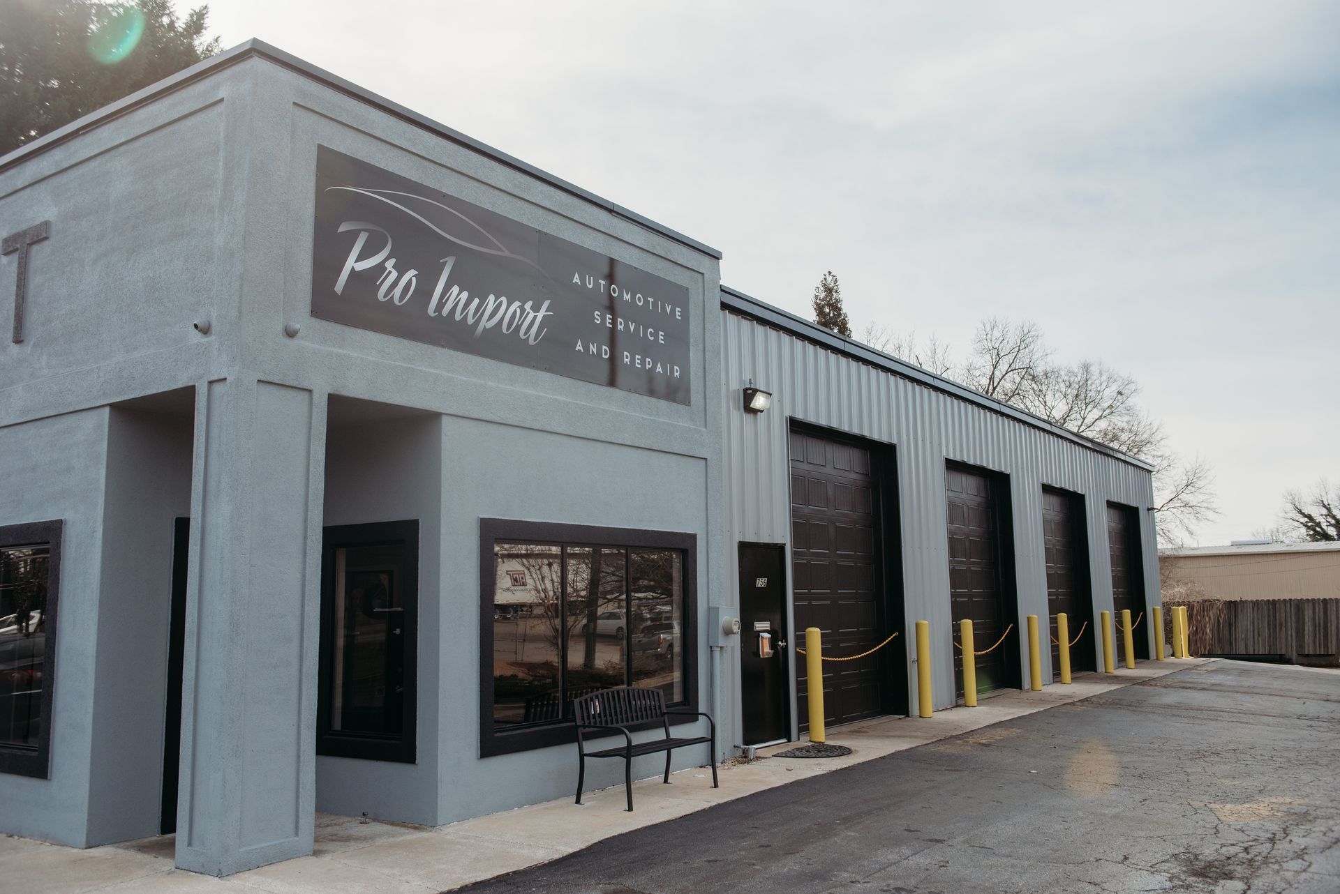 Front view of a gray commercial building | Pro Import Automotive Service and Repair