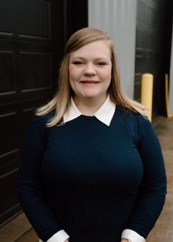 A person wearing a dark blue, ribbed long-sleeved shirt. | Pro Import Automotive Service and Repair