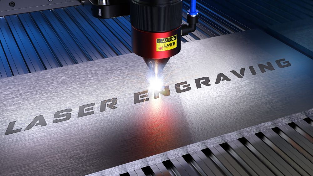 A Machine Is Engraving the Word Laser on A Piece of Metal  — Jimani Trophies & Engraving in Dapto, NSW