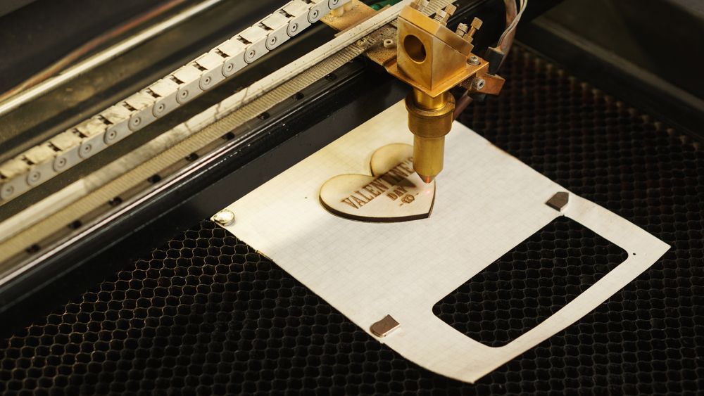 A Machine Is Cutting a Piece of Paper with The Letter D on It  — Jimani Trophies & Engraving in Dapto, NSW