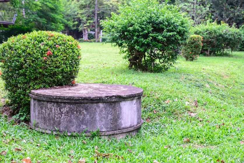 A Septic Tank Is Sitting In The Middle Of A Lush Green Field — Liquid Waste Disposal in Wauchope, NSW