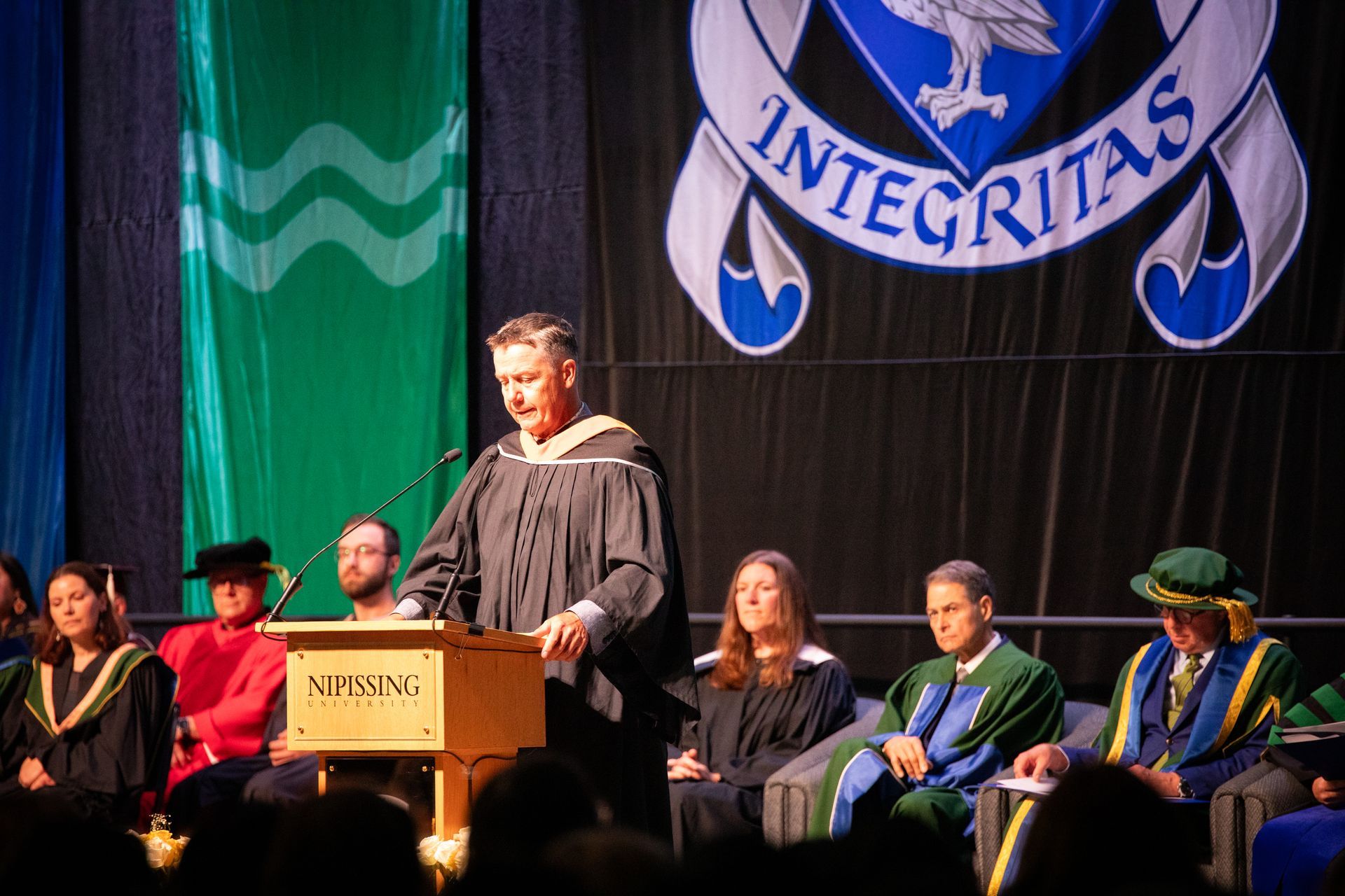 People on stage during Nipissing University Convocation 2026