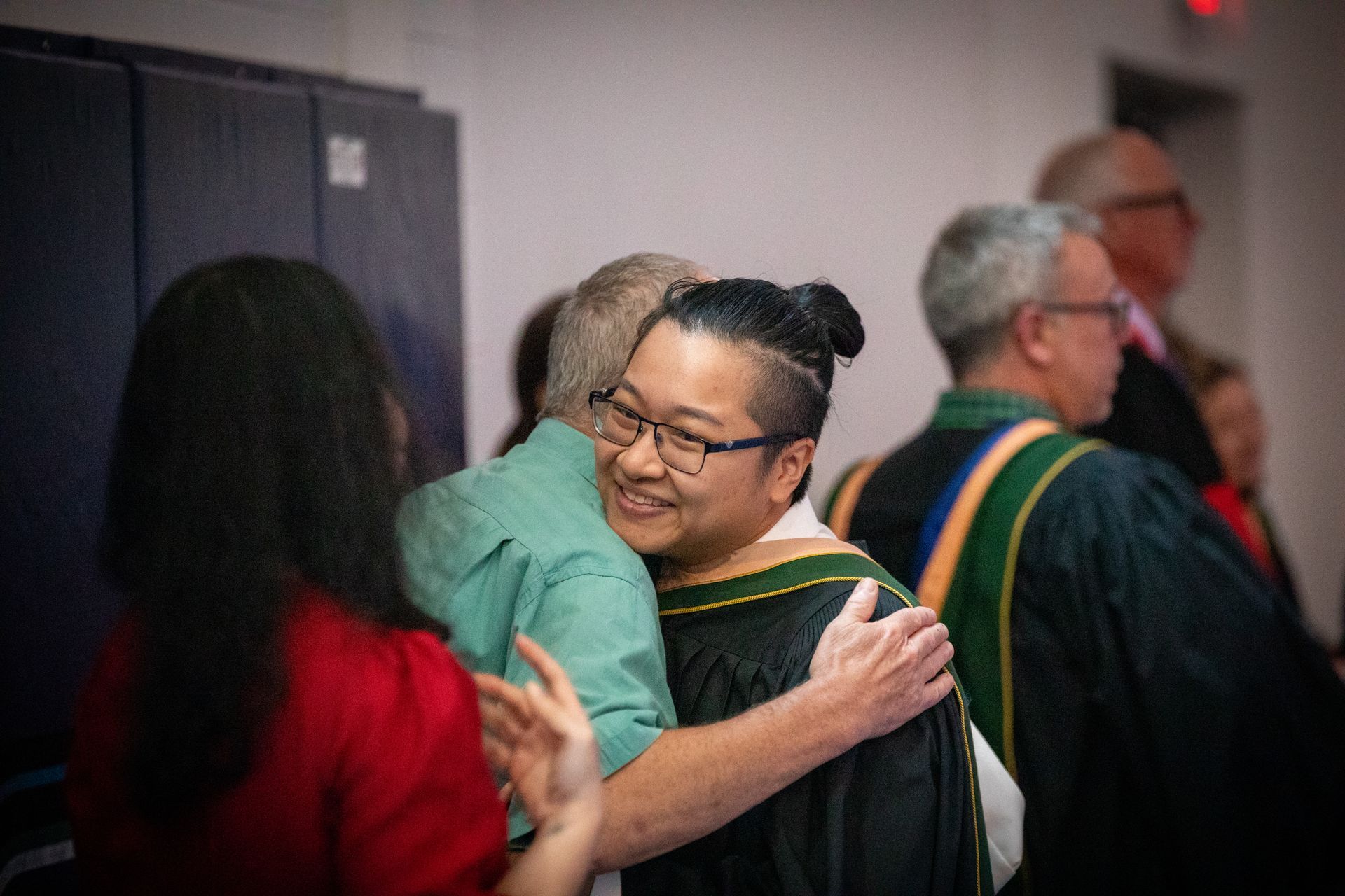 Nipissing University graduate with their family