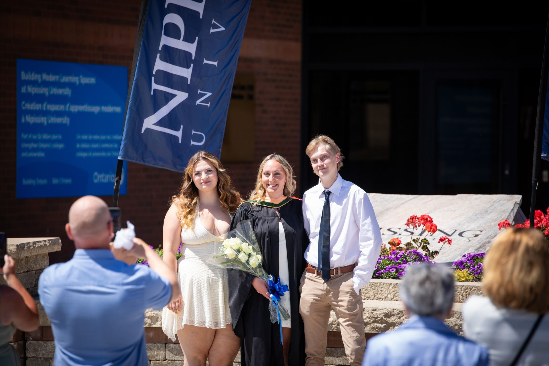 Nipissing University graduate with their family