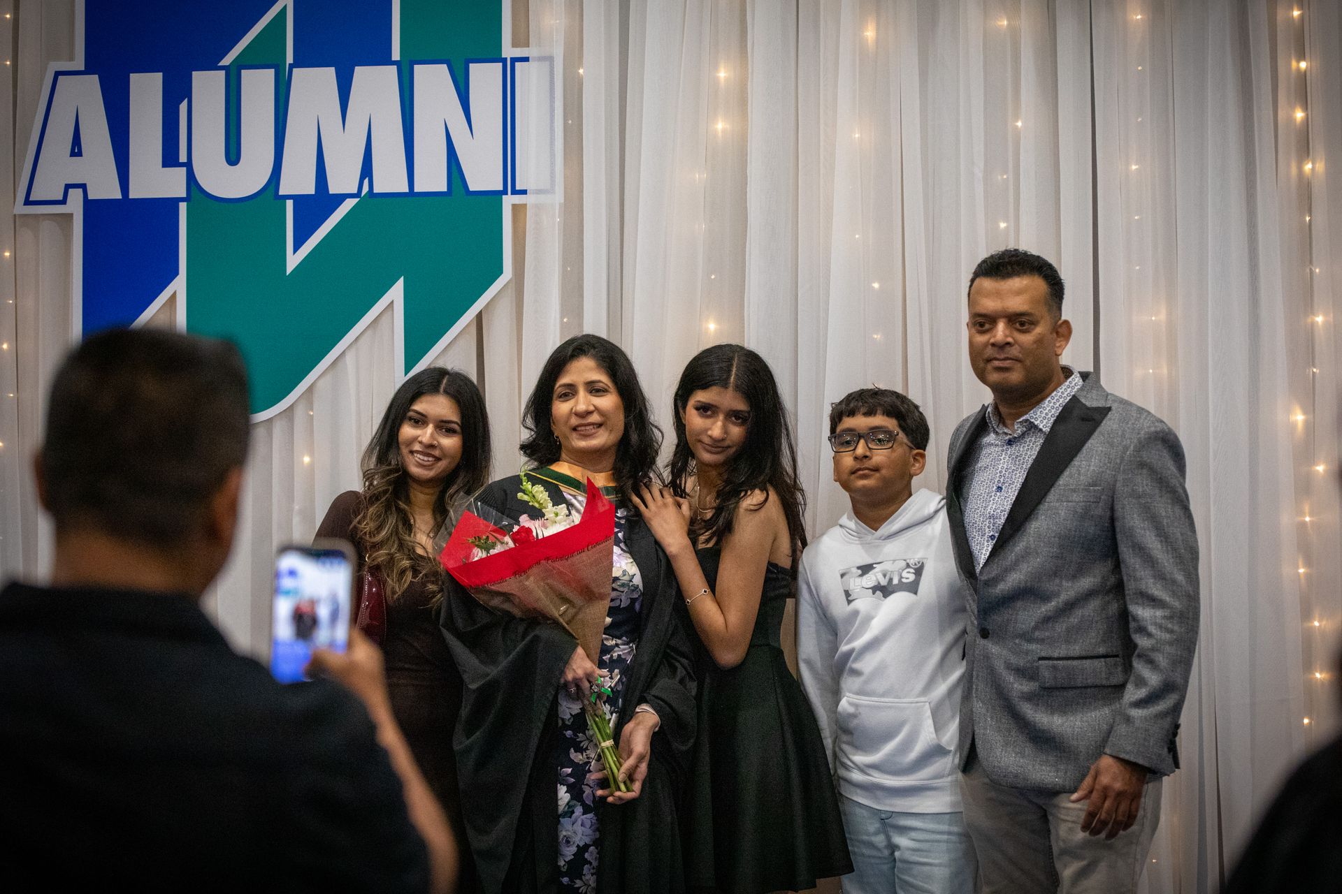 Nipissing University graduate with their family