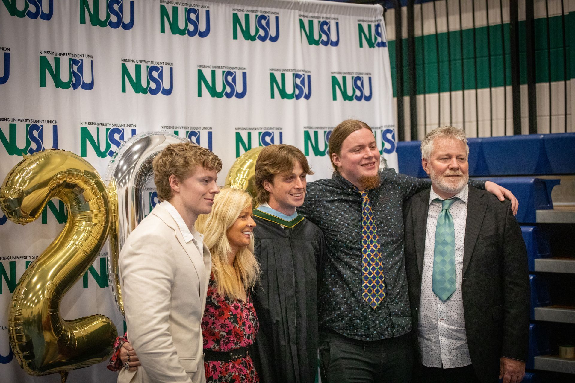 Nipissing University graduate with their family