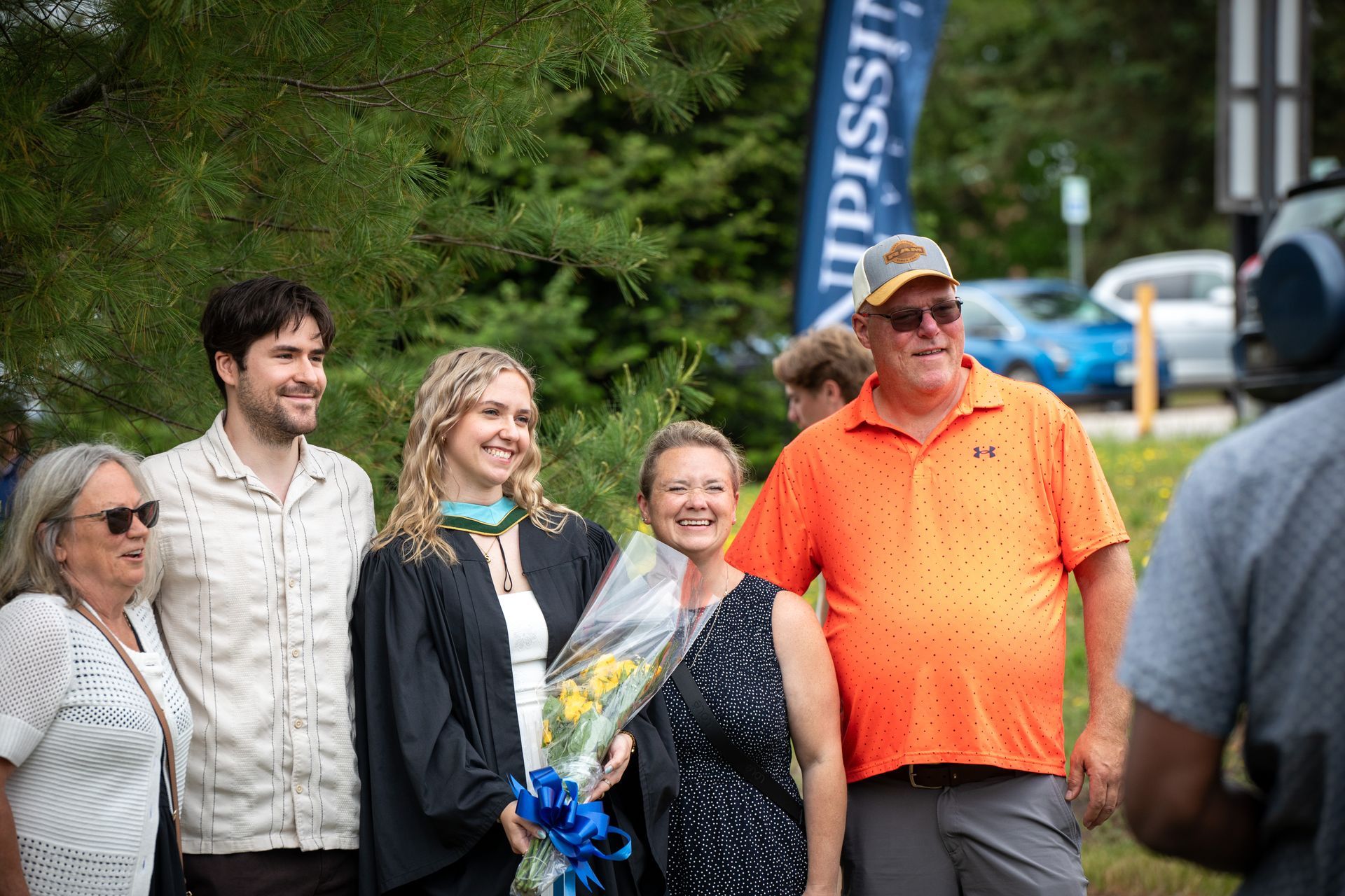 Nipissing University graduate with their family