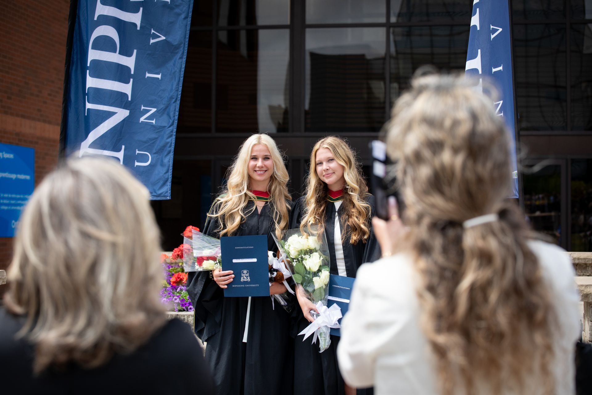 Nipissing University graduates posing for a photo