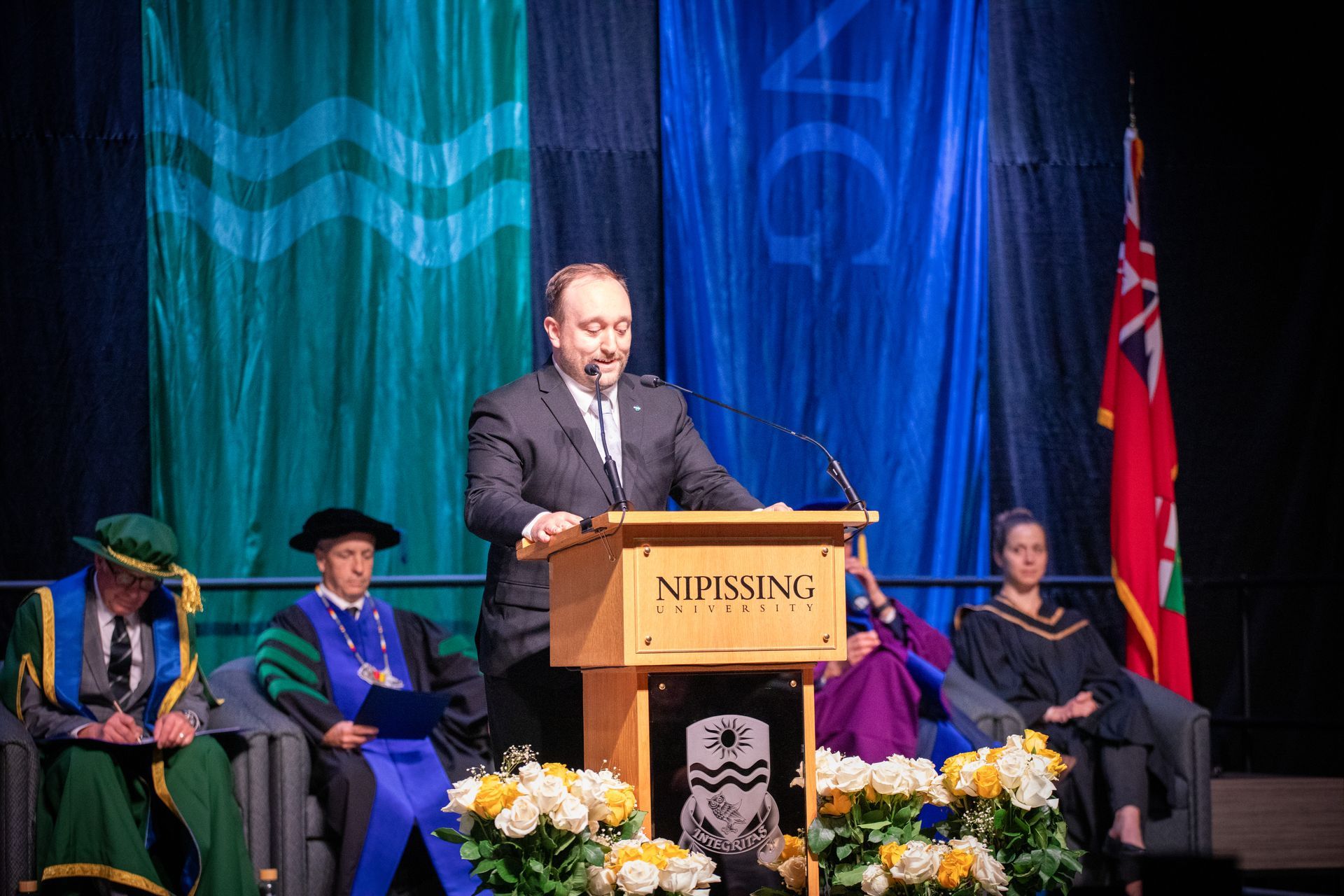 People on stage during Nipissing University Convocation 2026