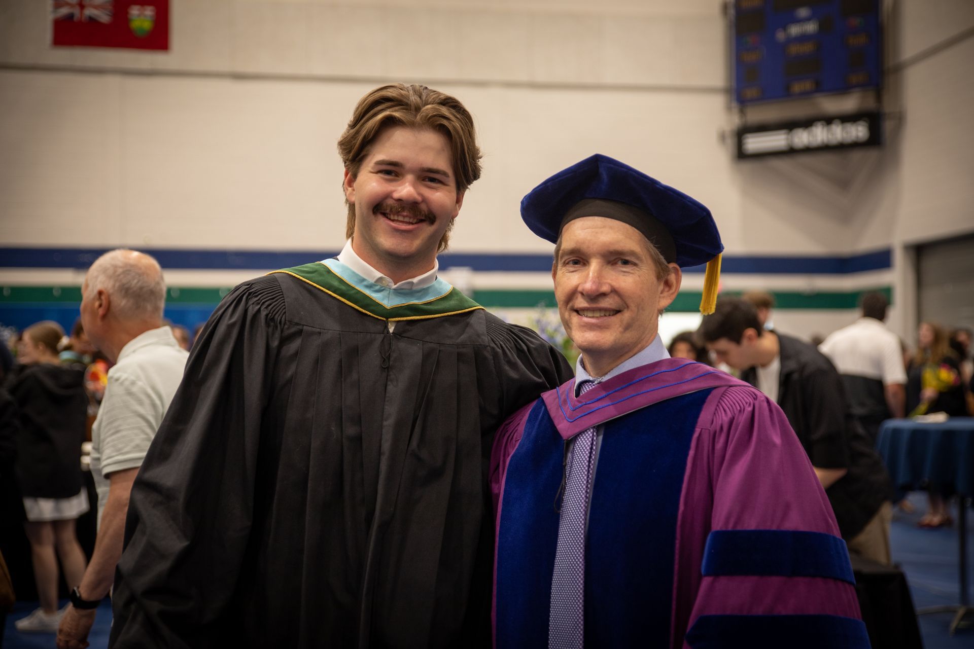 Nipissing University graduate with faculty member