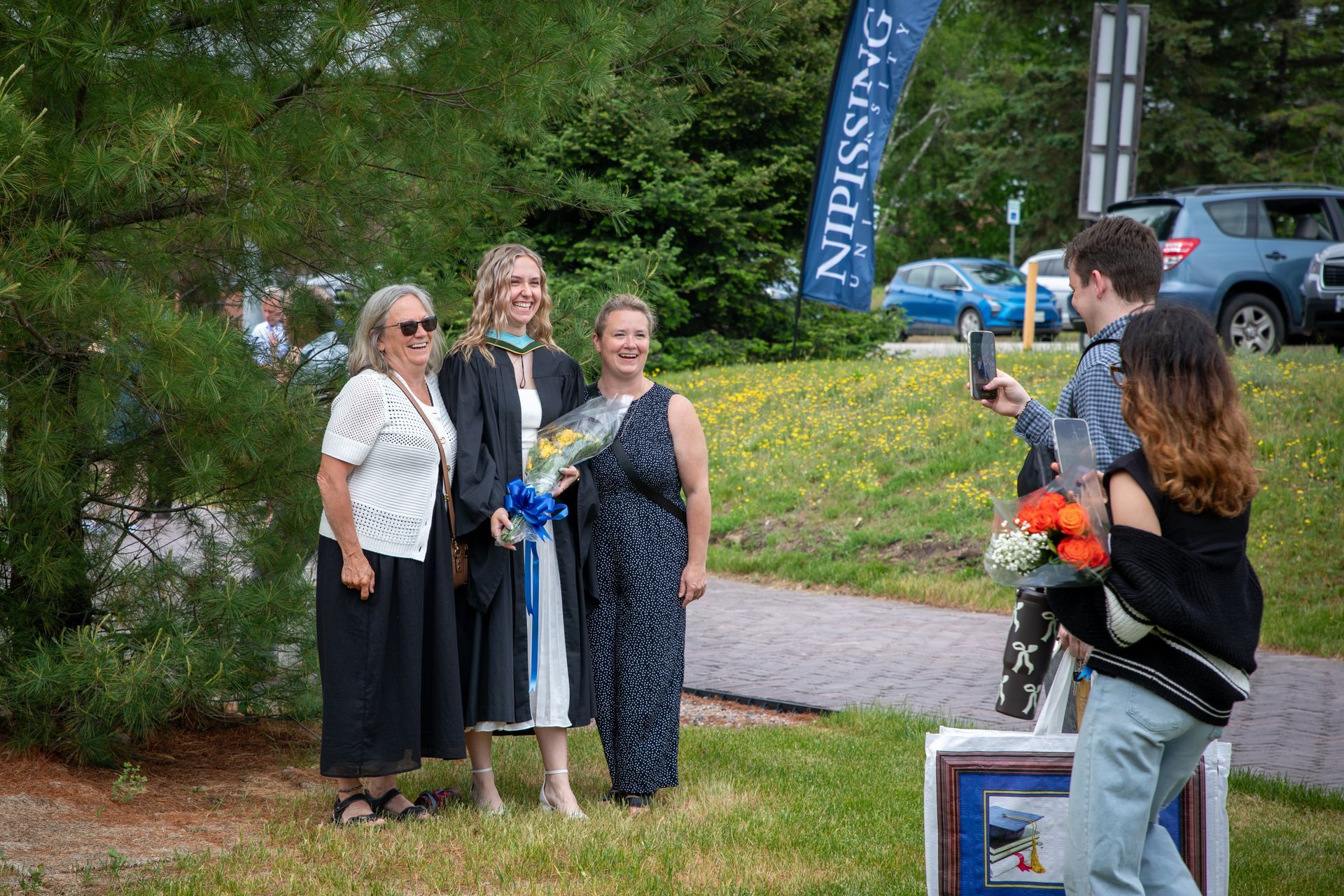 Nipissing University graduate with their family
