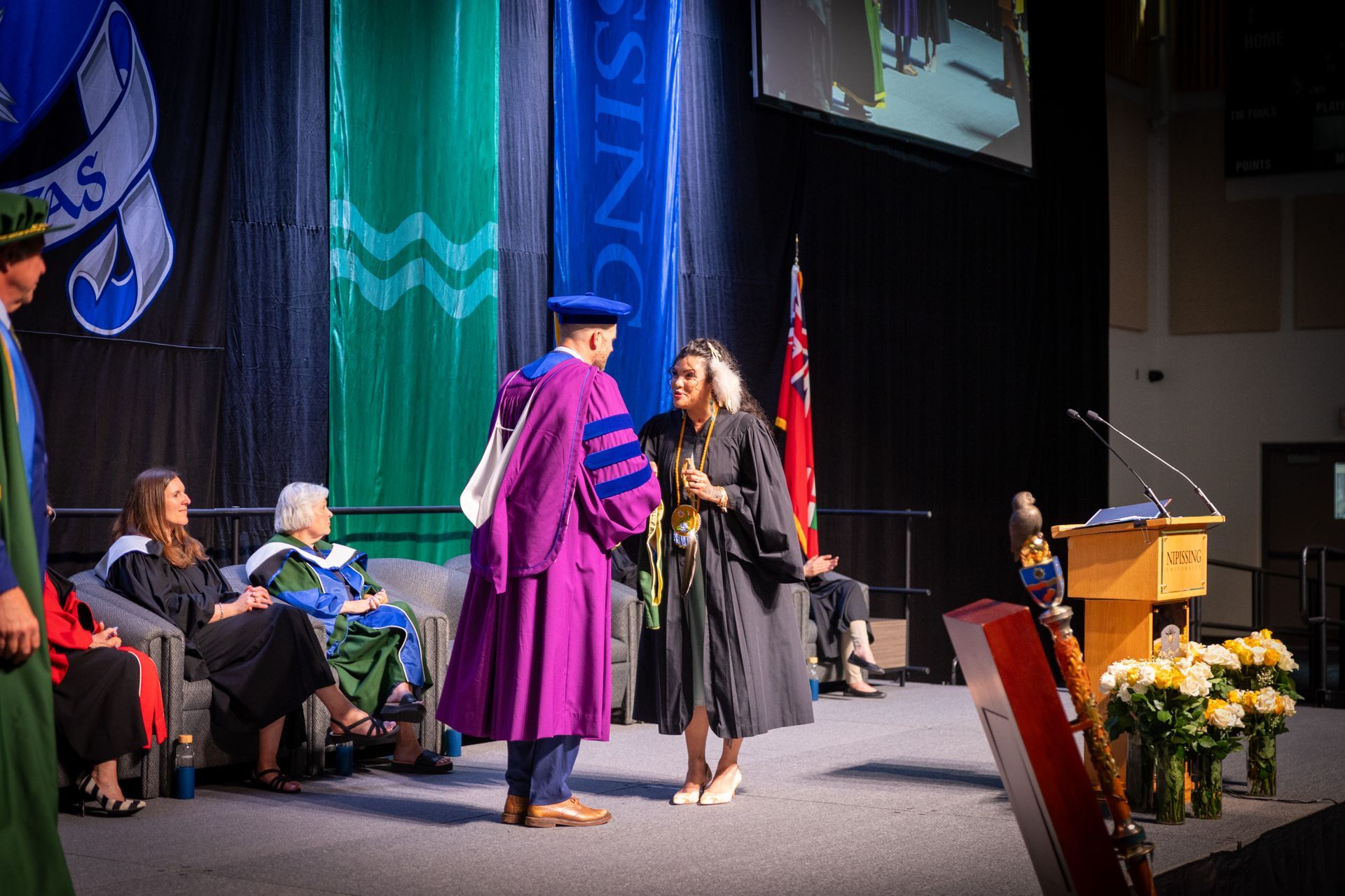 People on stage during Nipissing University Convocation 2026