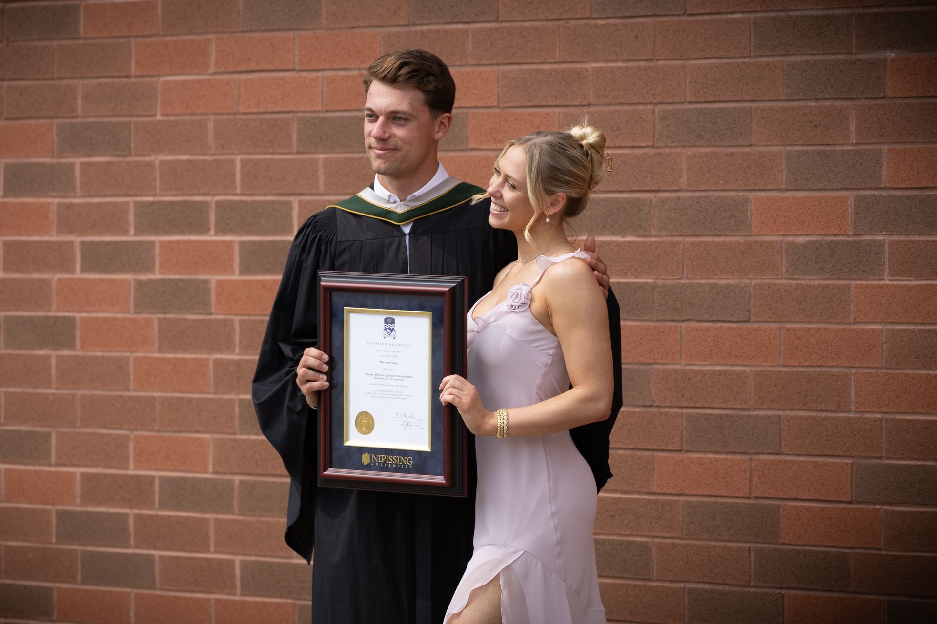 Nipissing University graduate with their family
