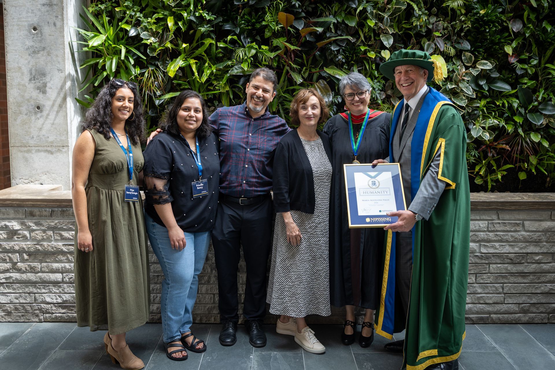 Nipissing University graduate with their family
