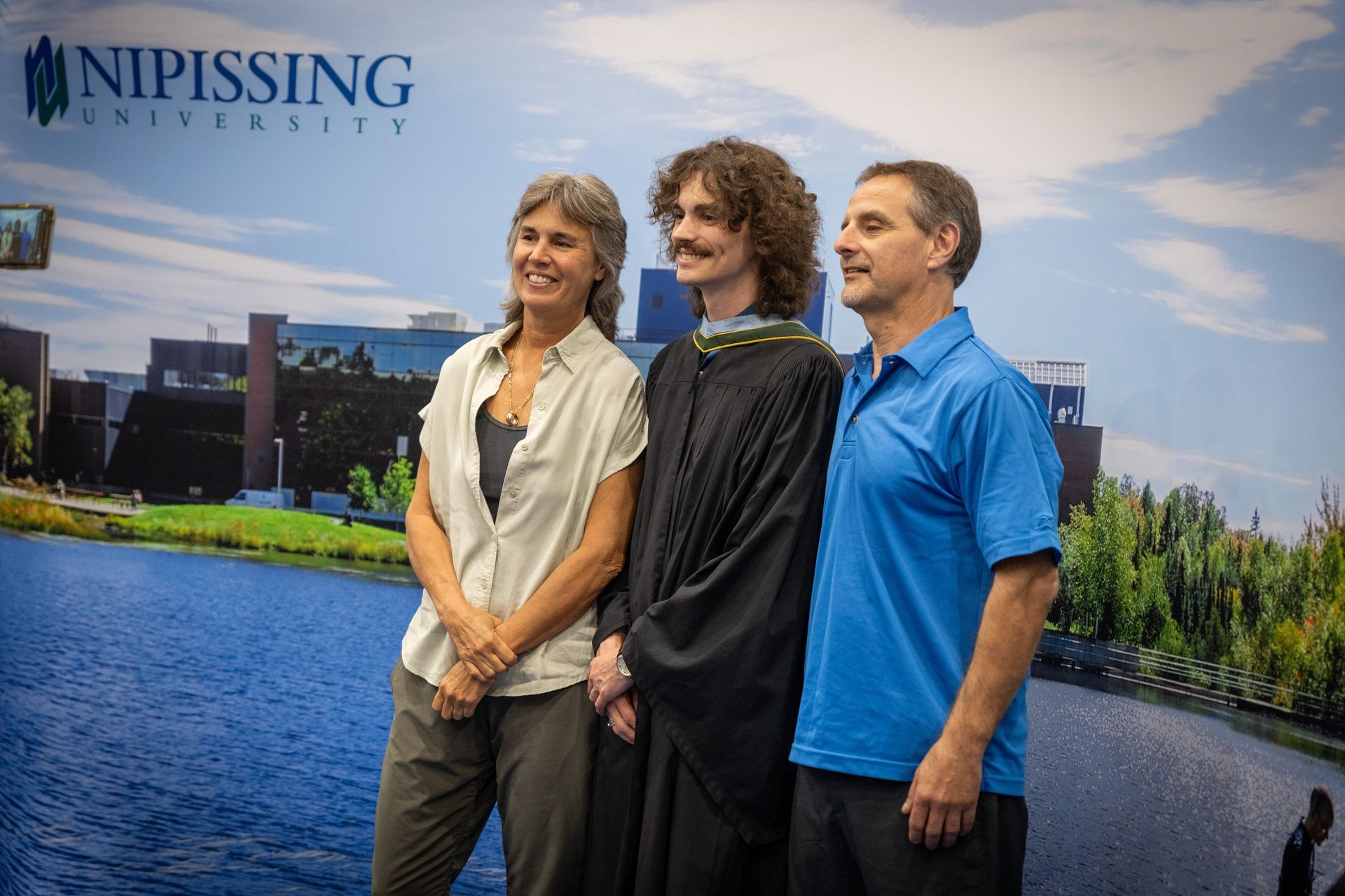 Nipissing University graduate with their family