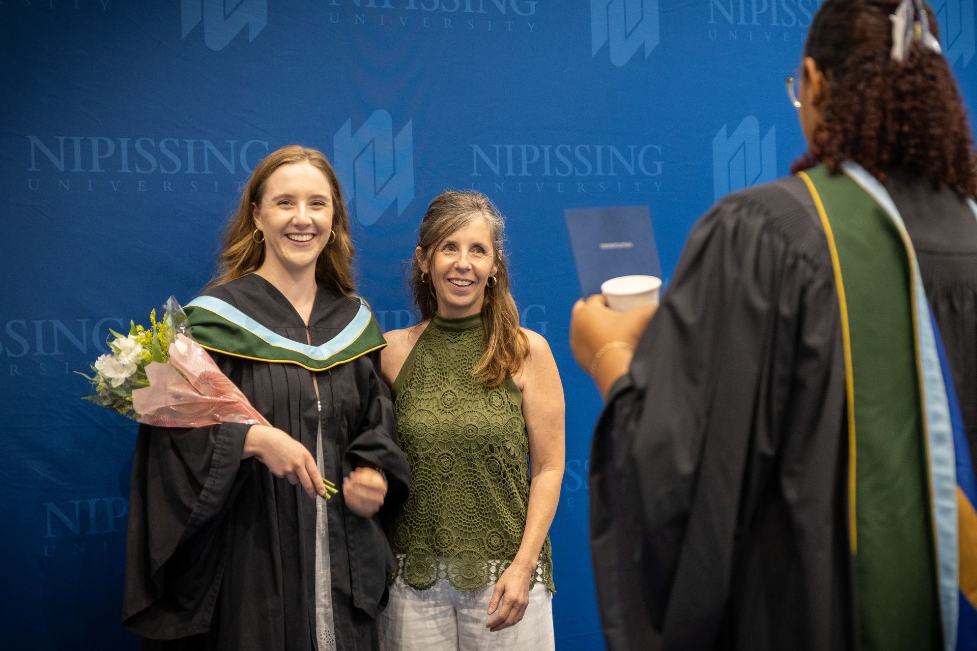 Nipissing University graduate with their family