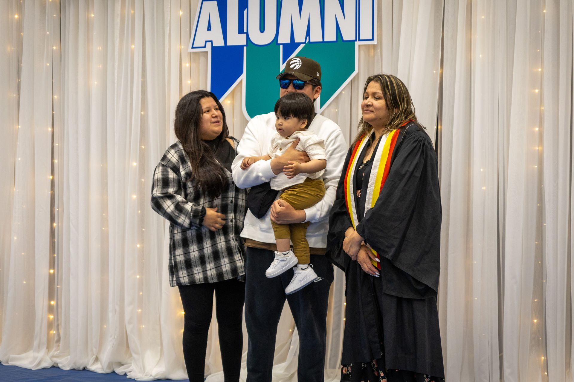 Nipissing University graduate with their family 