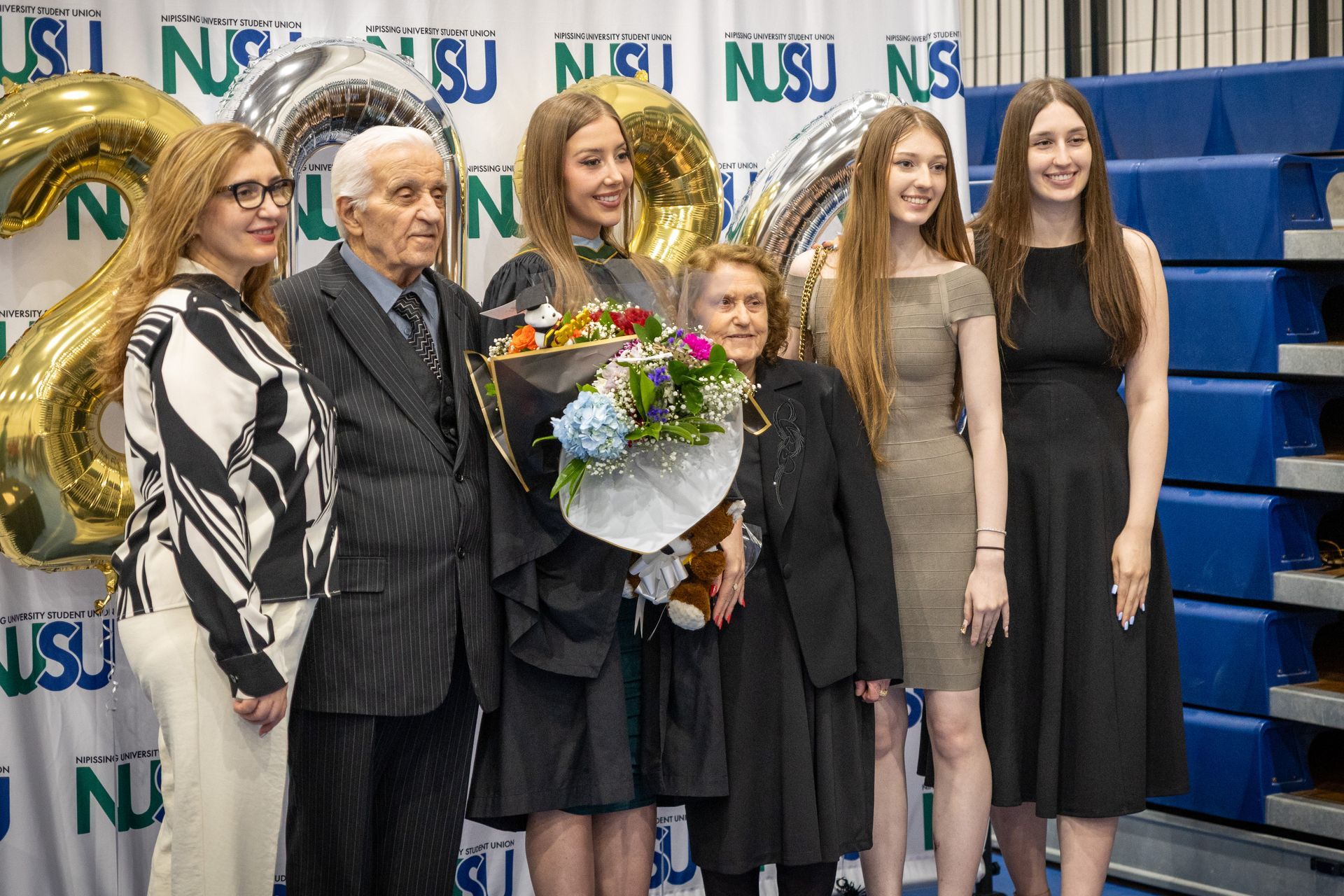 Nipissing University graduate with their family