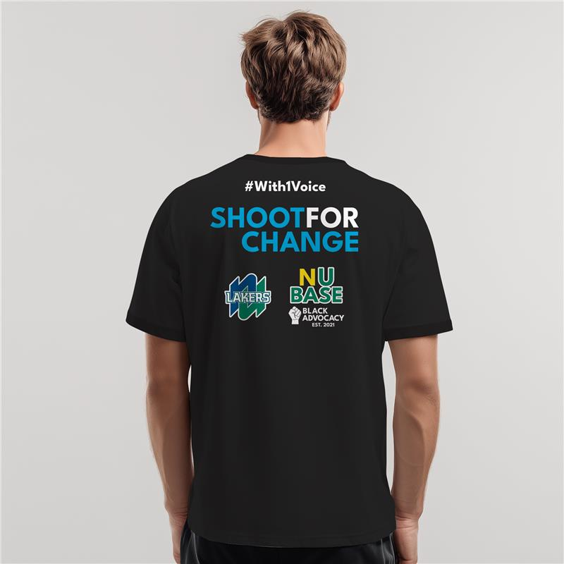 Back view of a person wearing a black “Shoot for Change” T-shirt with colorful campaign logos.