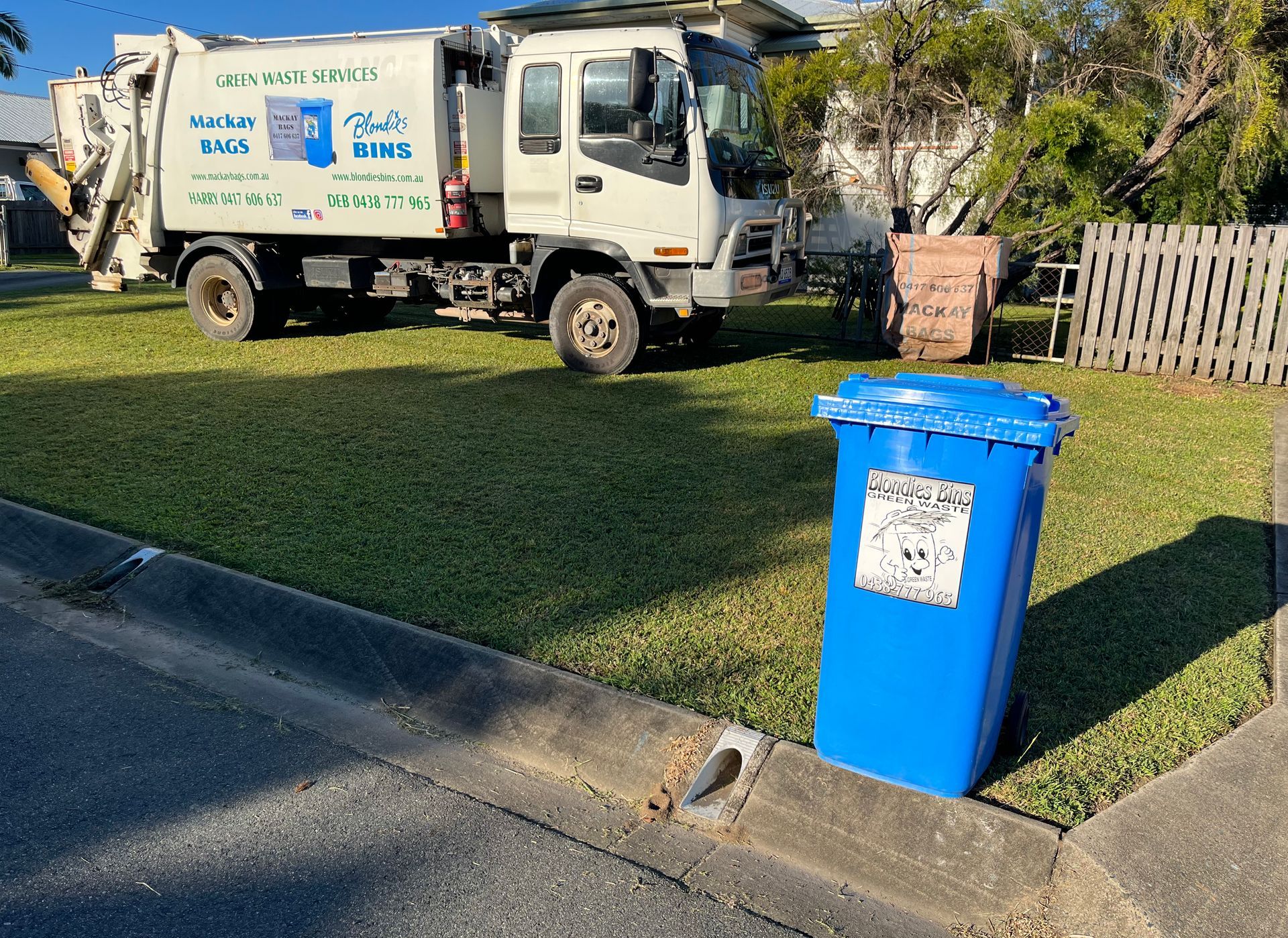 A blue trash can next to a brown bag that says mackay bags — Mackay Bags in East Mackay, QLD