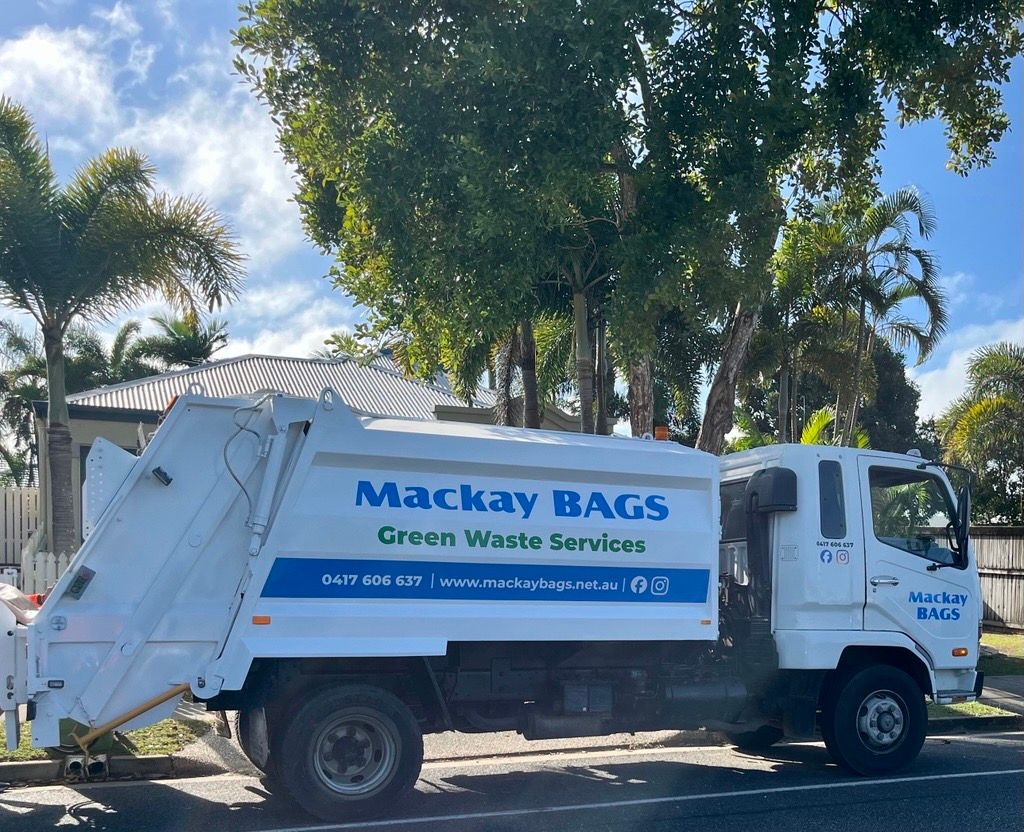 A Person Is Holding A Pile Of Leaves In Their Hands — Mackay Bags in East Mackay, QLD