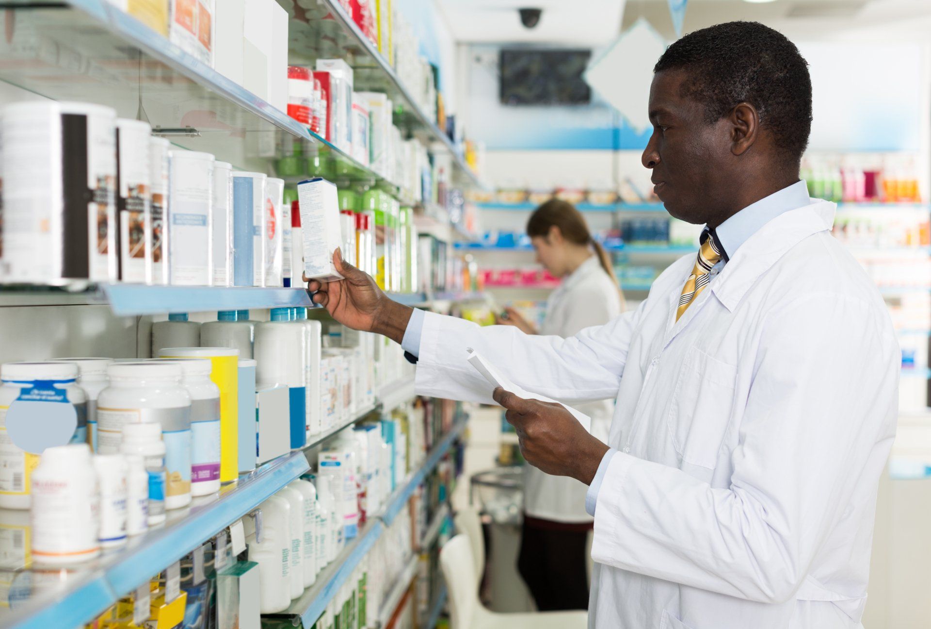 Pharmacy technician working with client orders