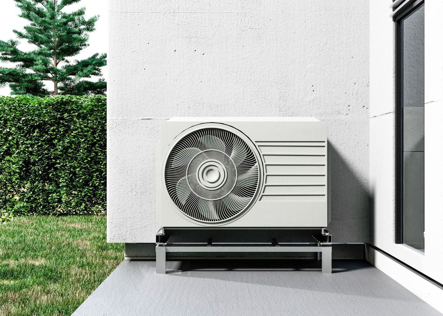 A white air conditioner is sitting on the side of a building.