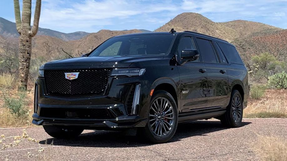 A black chevrolet suburban suv is shown on a white background.