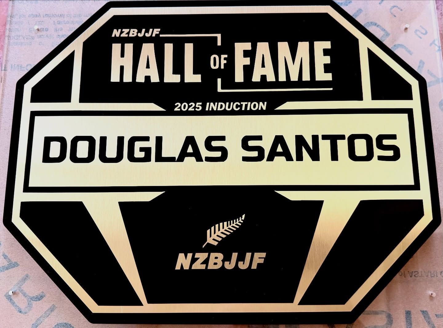 Black and gold BJJ Hall of Fame plaque for Douglas Santos, 2025 induction