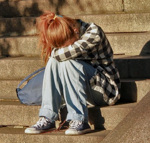 Pre-teen removed from a neglectful home is waiting to enter a stranger's house.