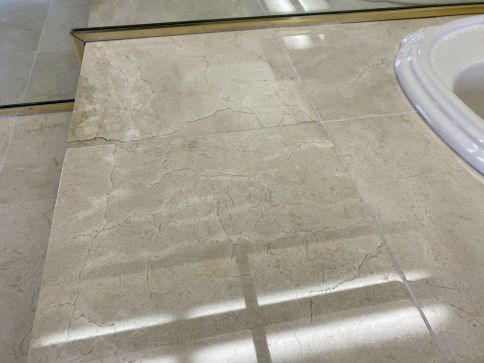 A bathroom counter top with a sink and a mirror.