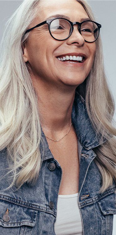 Cheerful Senior Woman With Eyeglasses — Facial Rejuvenation in Newcastle, NSW