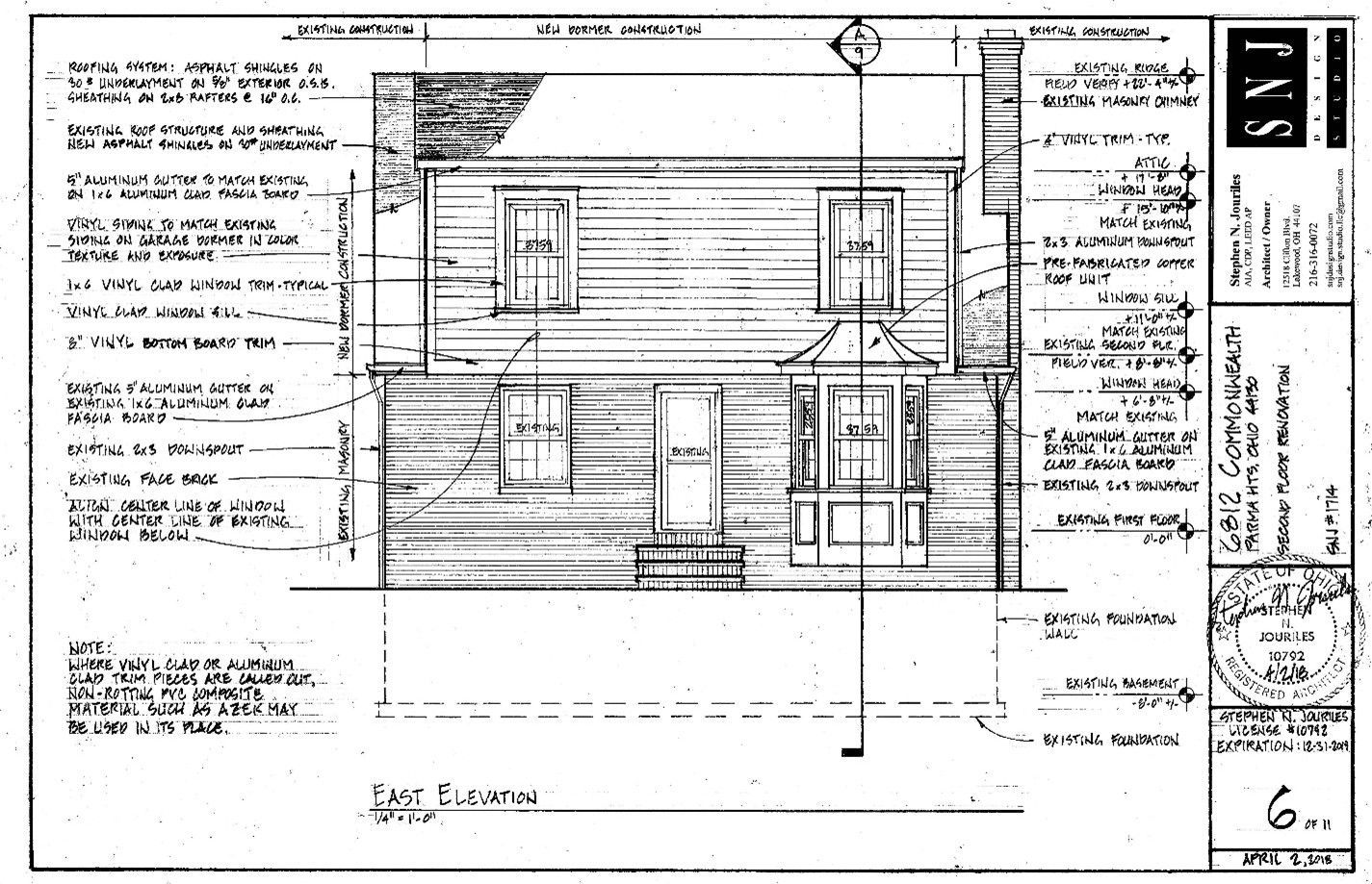 Architectural elevation drawing of a building facade with windows, a small porch, and notations.