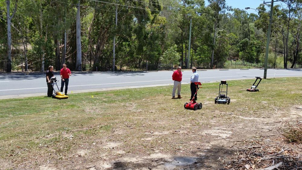 Group of People Using Ground-Penetrating Radar