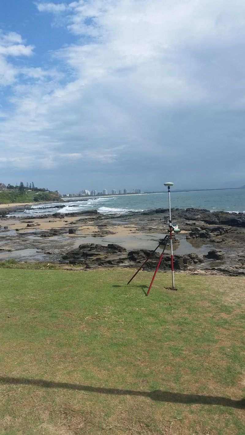 Surveying Land Close To The Body Of Water