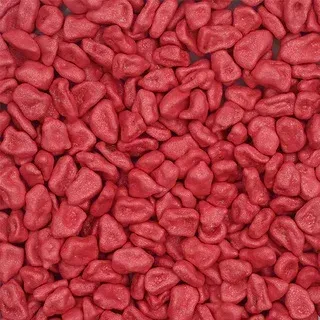 Pile of small red pebbles filling the frame