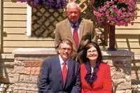 Springer-Voorhis-Draper Funeral Home history with four people on the side of their location with