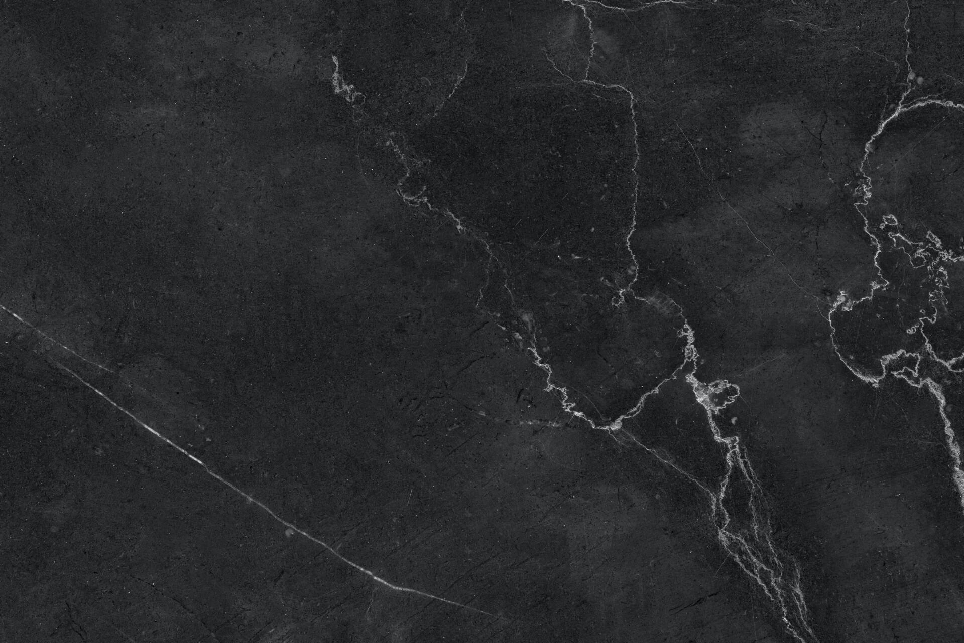 Dark gray stone texture with light veining.