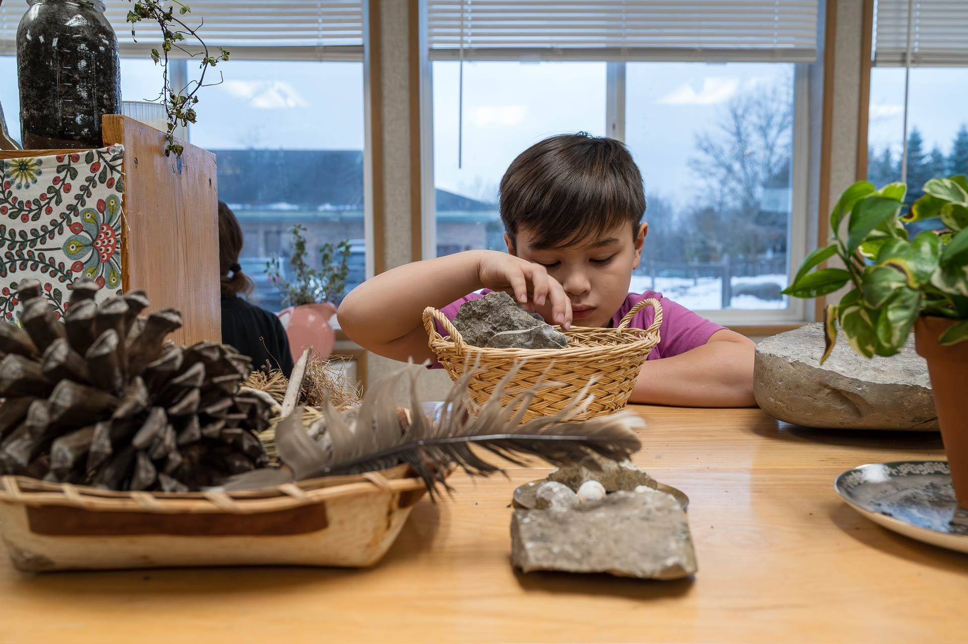 Montessori child working with science materials.
