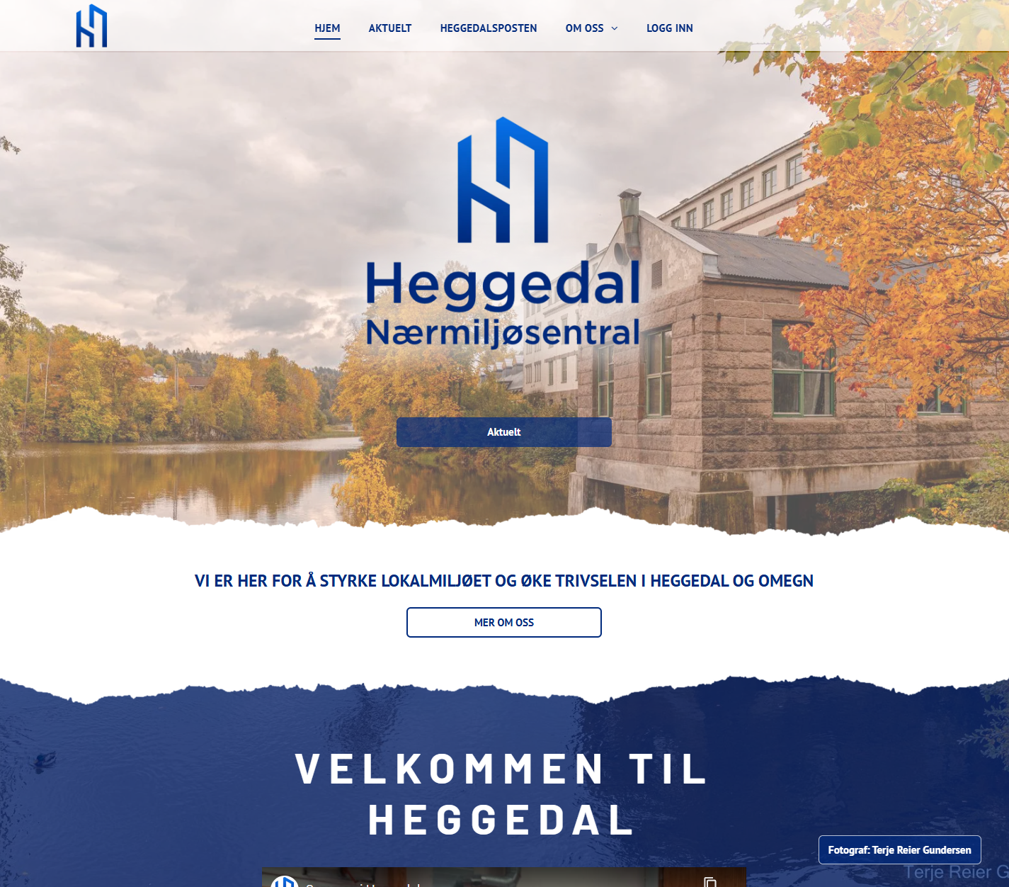 Heggedal Nærmiljøsenter homepage with logo over river and building background