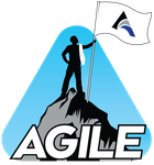 Silhouette of person on mountain peak holding flag that reads