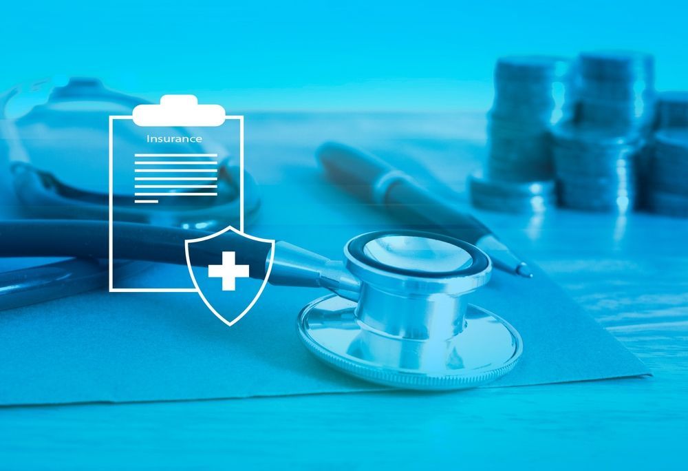Doctor’s stethoscope and medical icons on a blue desk background