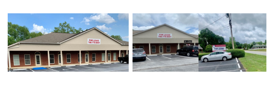 Low brick storefront with tan roof, parking lot, and a white SUV parked outside under cloudy skies