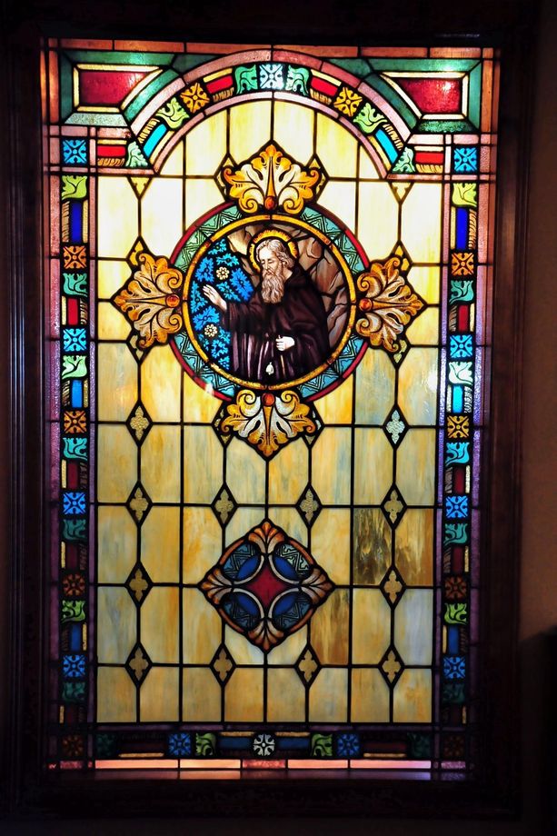 Stained glass gallery creating a peaceful, light-filled space for reflection and remembrance