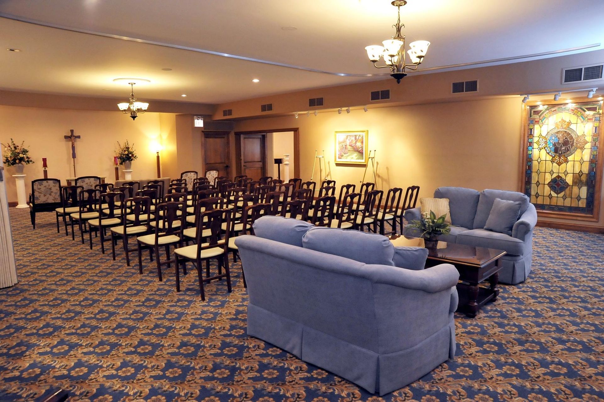 Comfortable blue sofa seating provides a calming space for family conversations and support