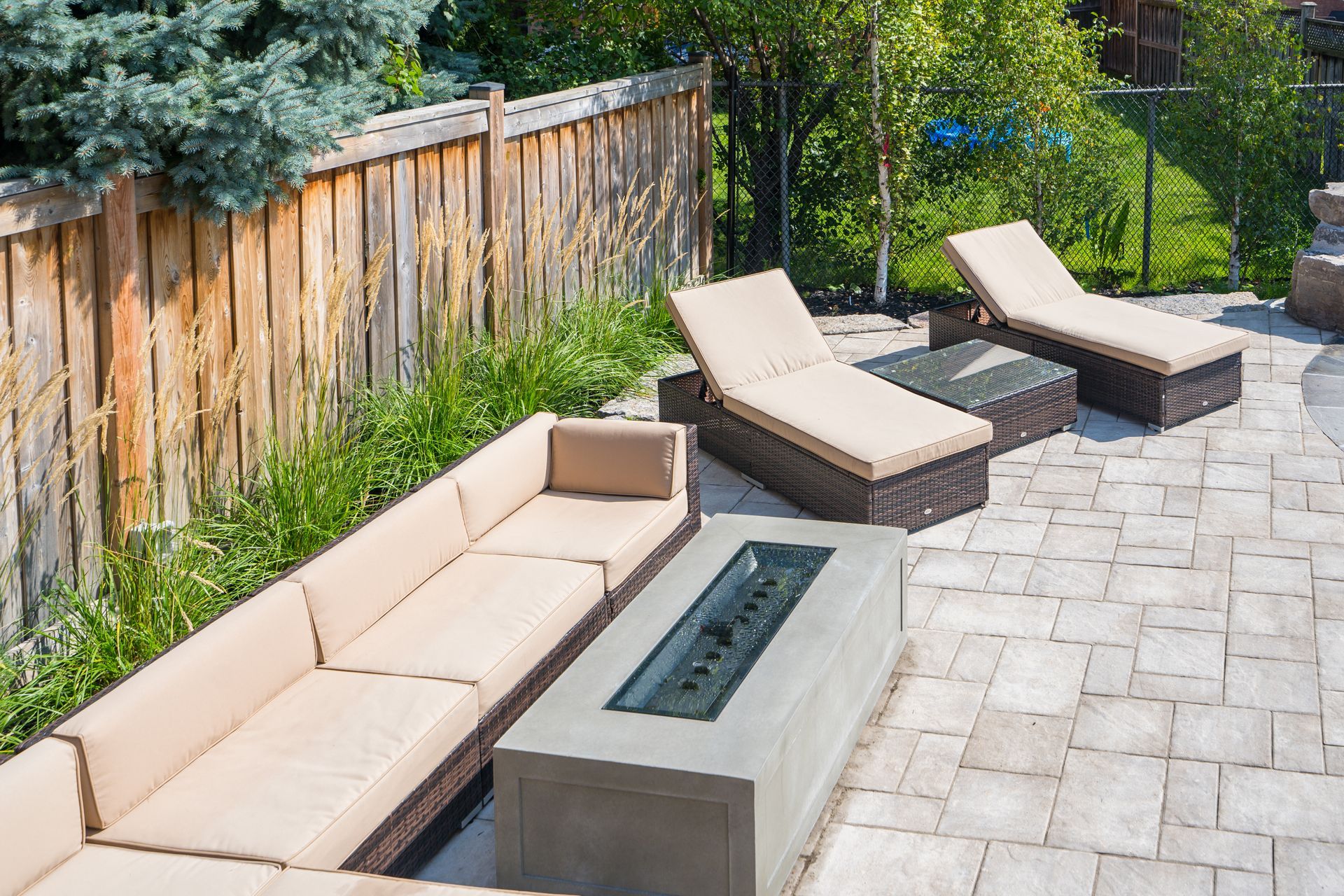 There is a fire pit in the middle of the patio.