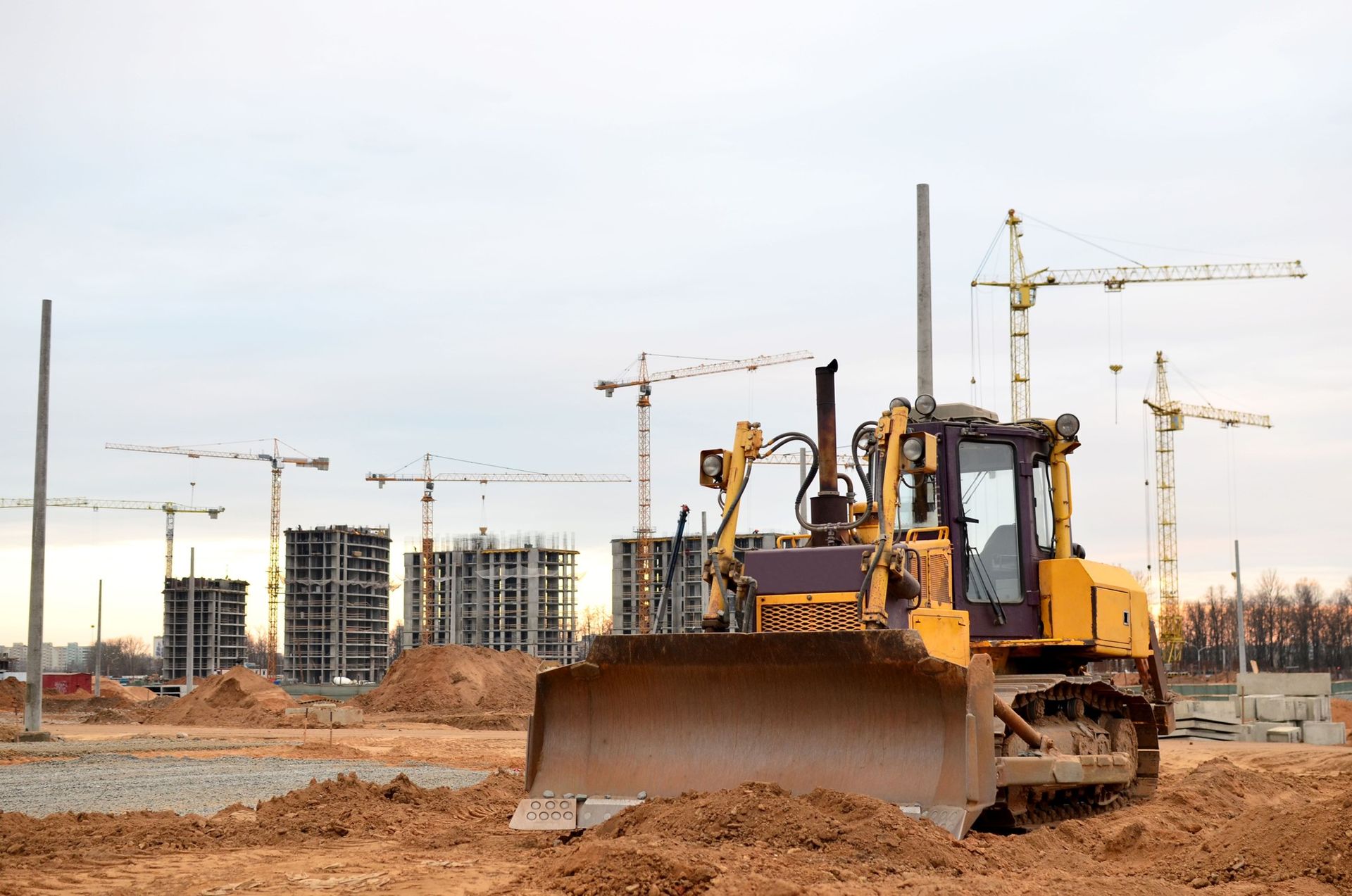A bulldozer is moving dirt on a construction site.