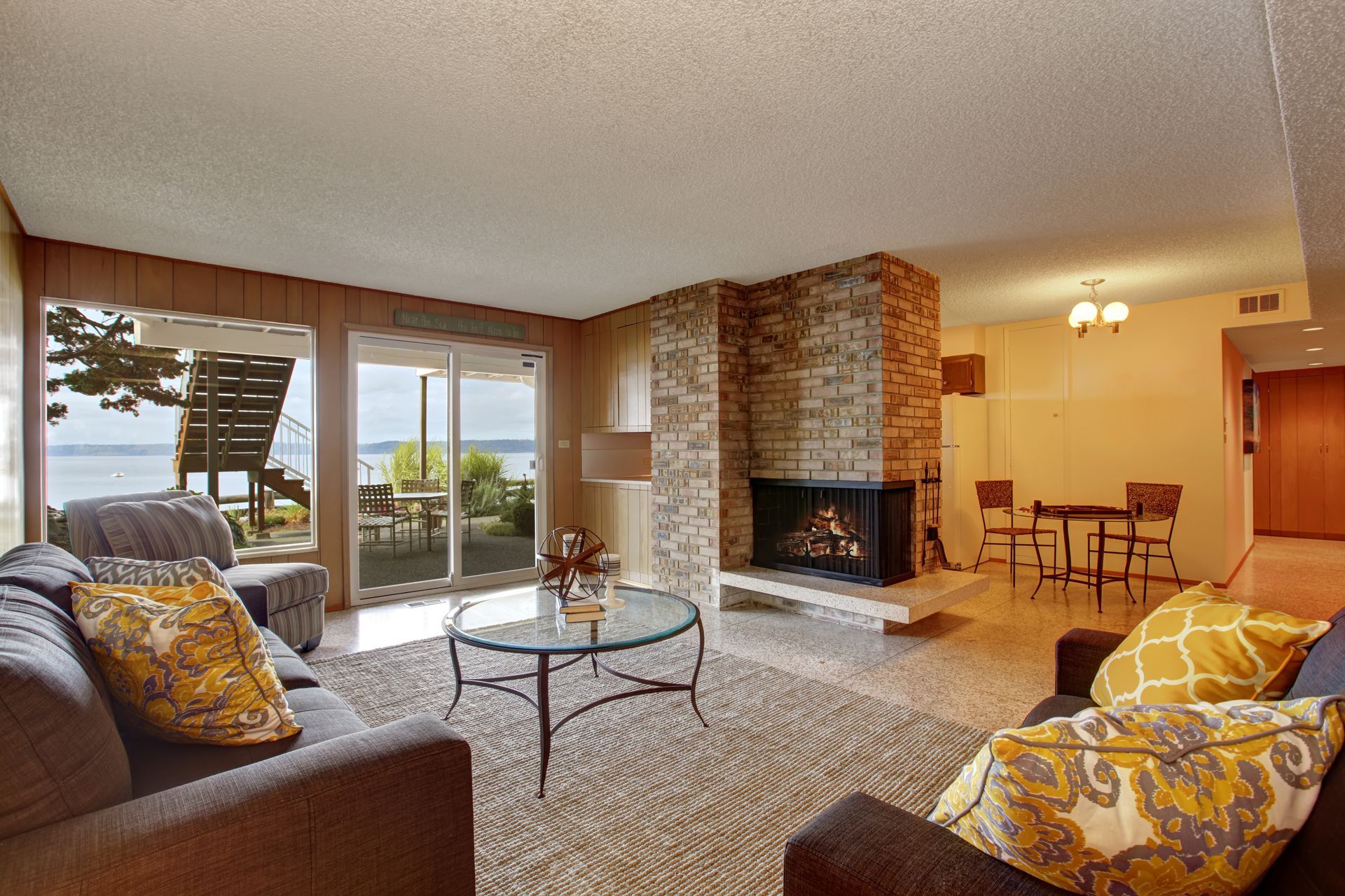 A living room with a fireplace and a couch