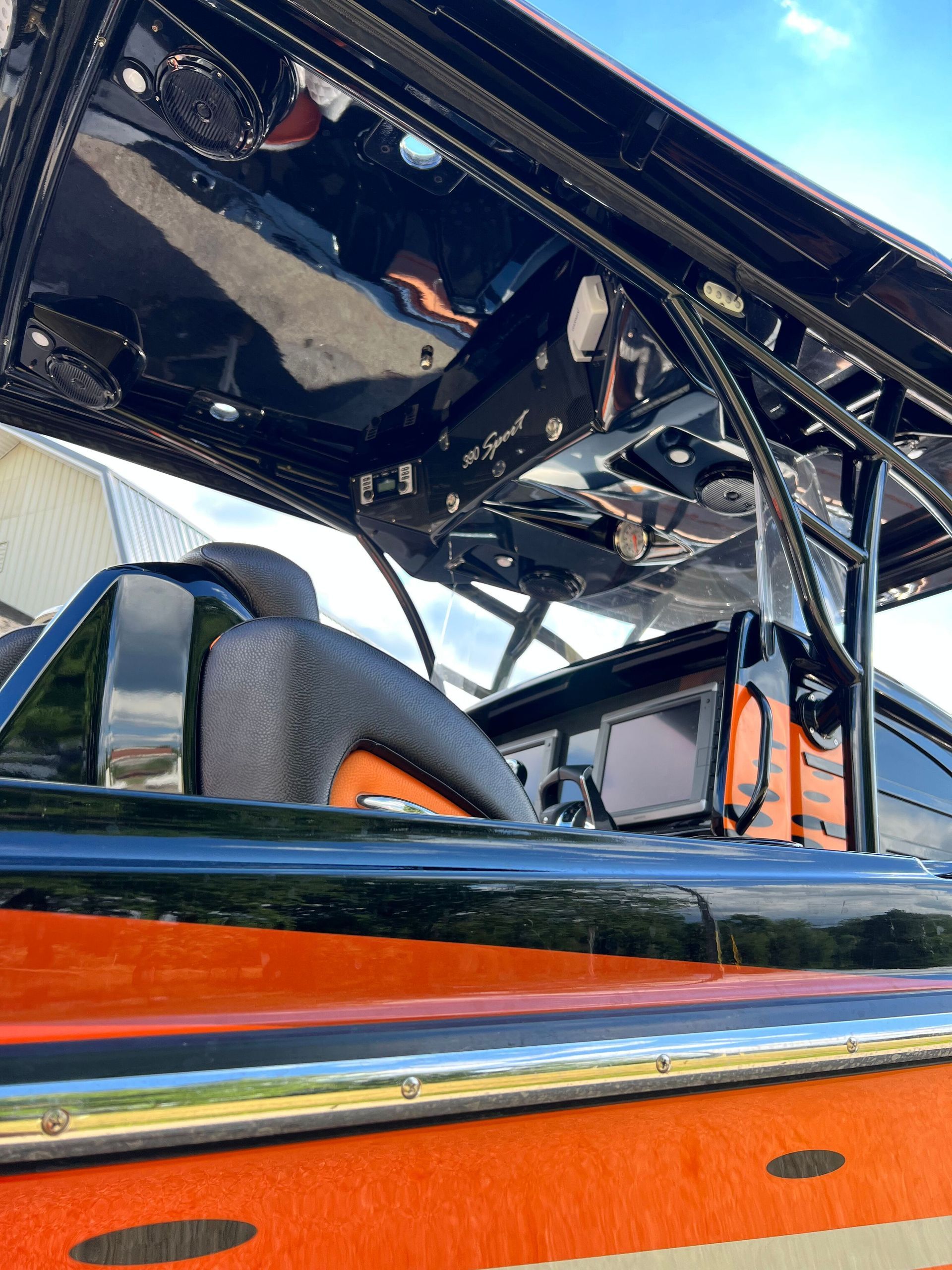 A close up of the inside of a boat with the roof open.