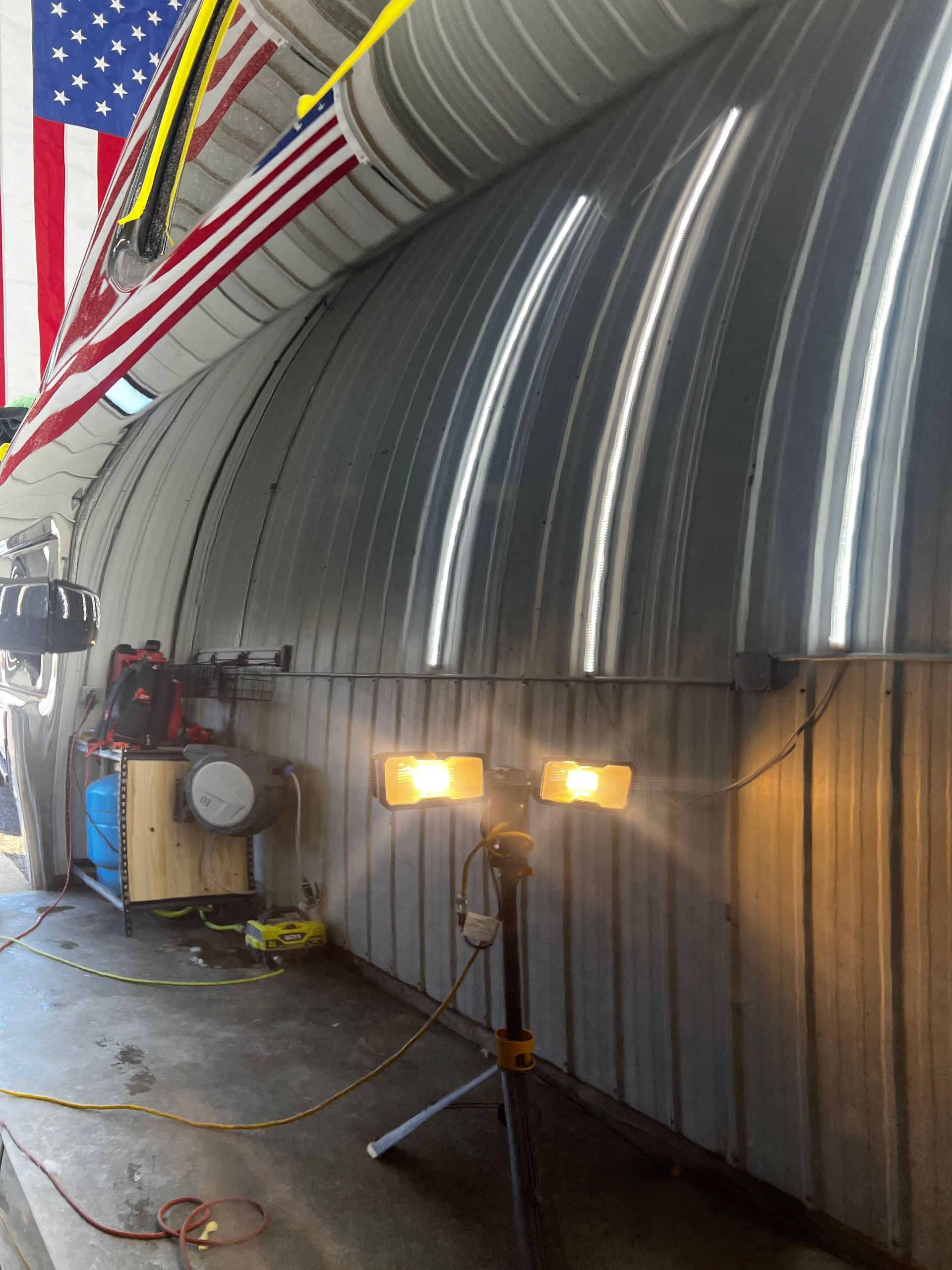 An american flag hangs from the ceiling of a building